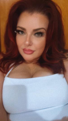 Foxy Redhead with Curves to Die For